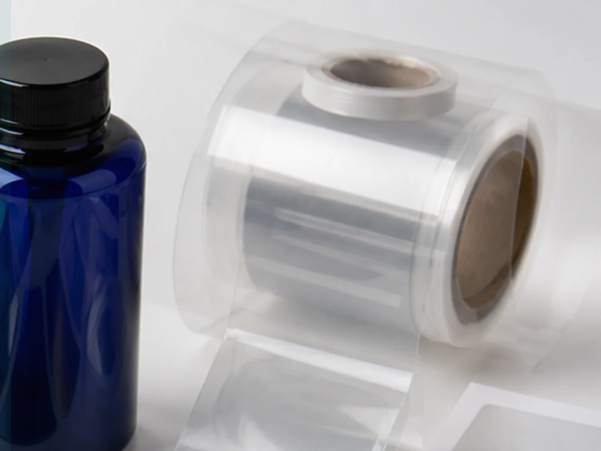 PET clear label material on transparent bottle packaging